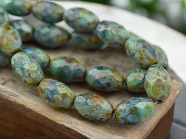 *12* 12x8mm Mottled Turquoise Picasso Fire Polished Faceted Oval Beads