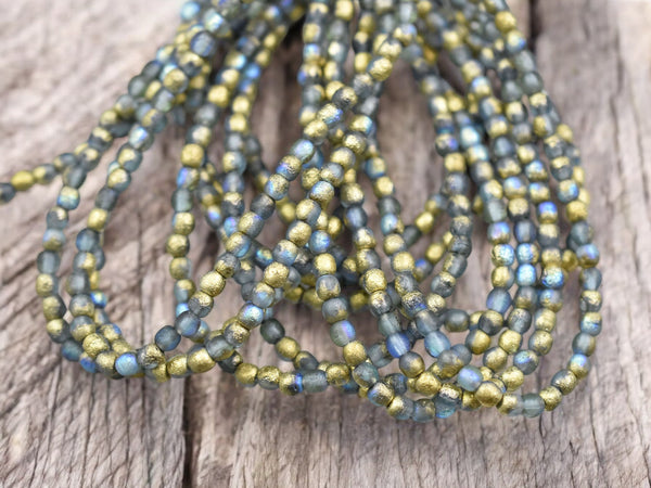 *50* 3mm Gold Washed Etched Montana Blue AB Round Druk Beads